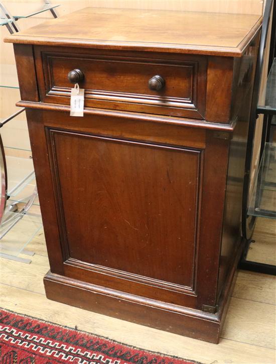 A Victorian mahogany pedestal cupboard, with lifting top and dummy frieze drawer, with panelled door below, W.61cm